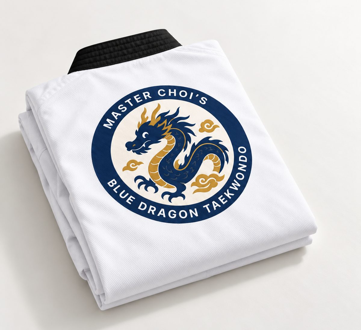 Taekwondo uniform with print, folded, showing the Blue Dragon logo